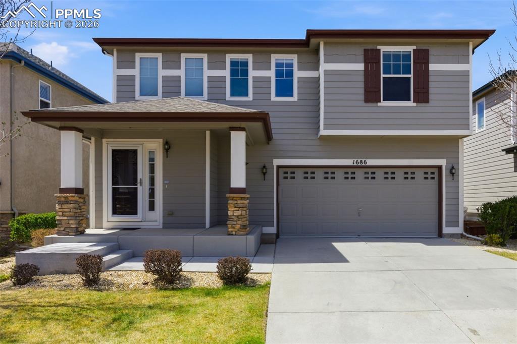 Image 30 of 34: Two-story exterior with gray siding and white trim