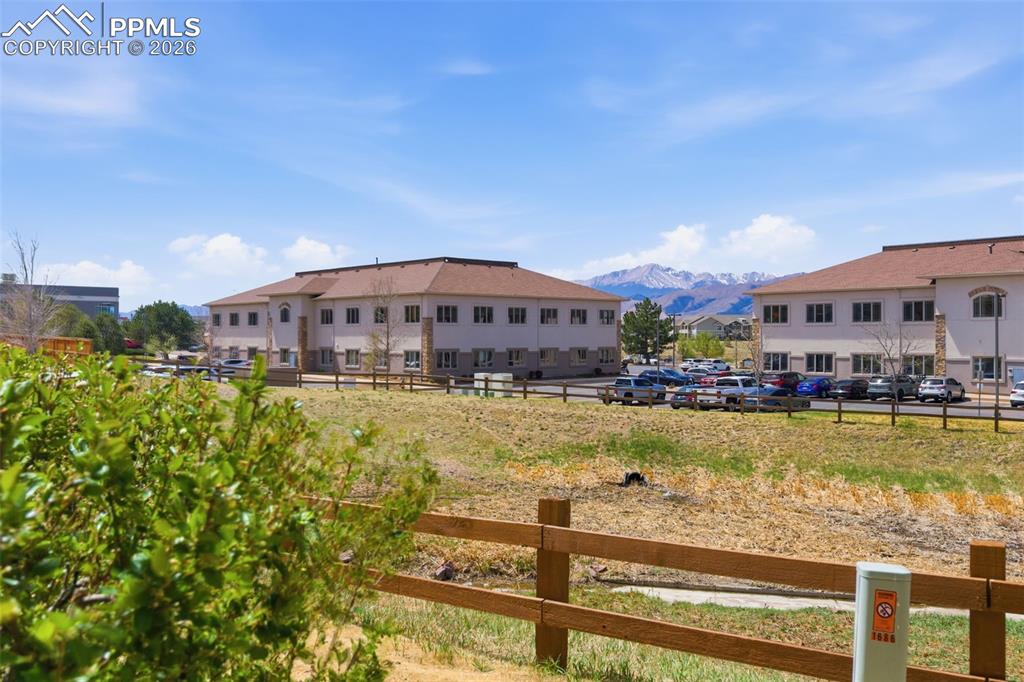 Image 31 of 34: A View of Distant mountain range backdrop, expansive blue sky, and nearby b