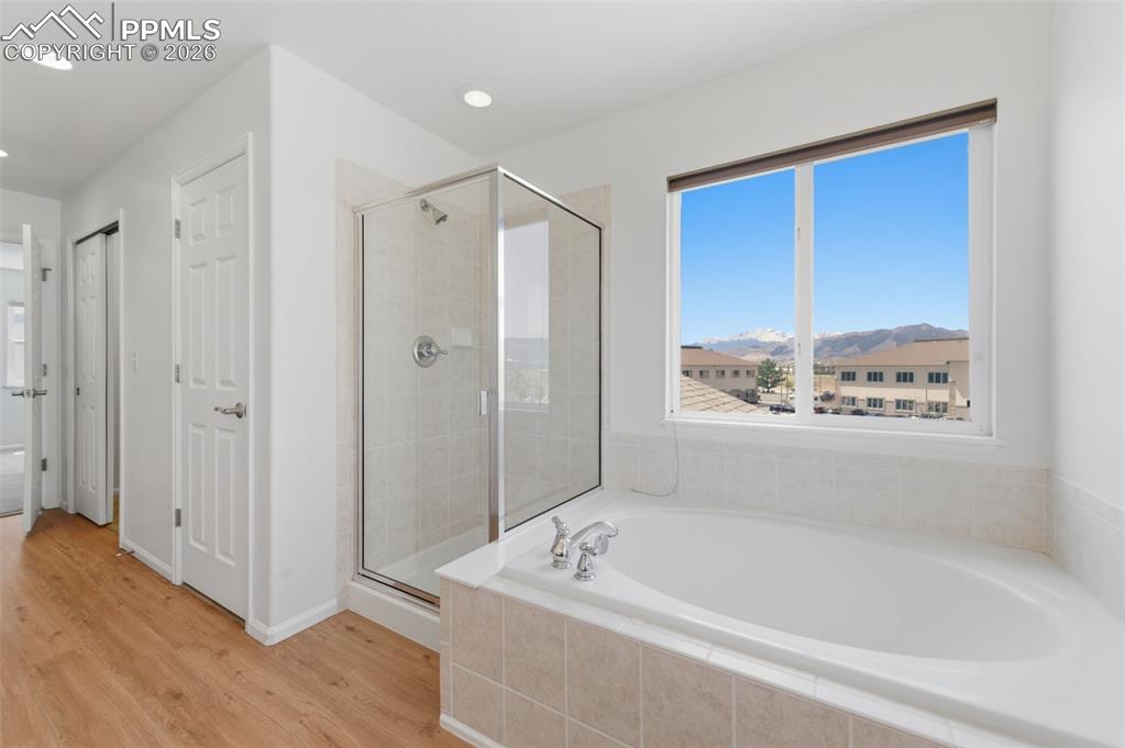 Image 8 of 34: Primary Bath, soaking tub, step in shower, Larger Linen closet, double walk