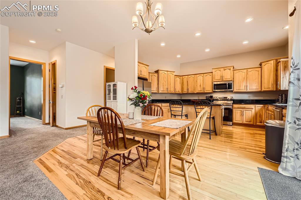 Image 11 of 50: Dining room with recessed lighting, light wood-style flooring, baseboards, 
