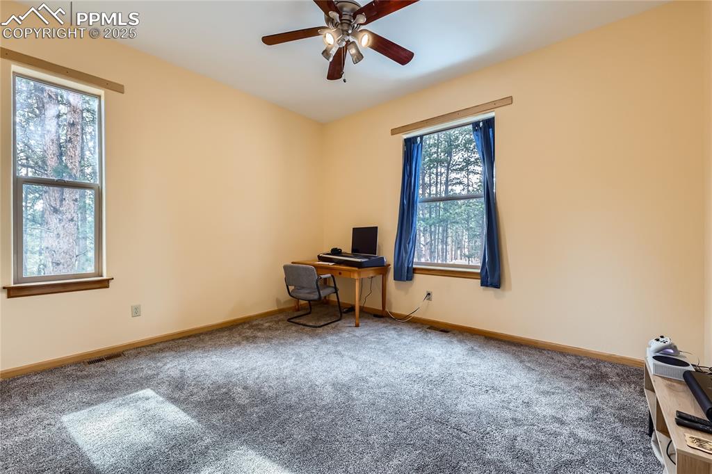 Image 28 of 50: Unfurnished office featuring carpet flooring, visible vents, baseboards, an