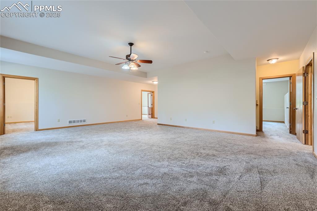 Image 33 of 50: Unfurnished room featuring light carpet, visible vents, and baseboards