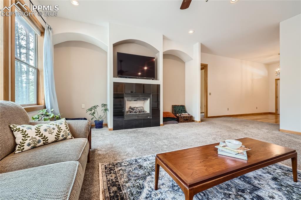 Image 8 of 50: Carpeted living room featuring recessed lighting, baseboards, ceiling fan, 