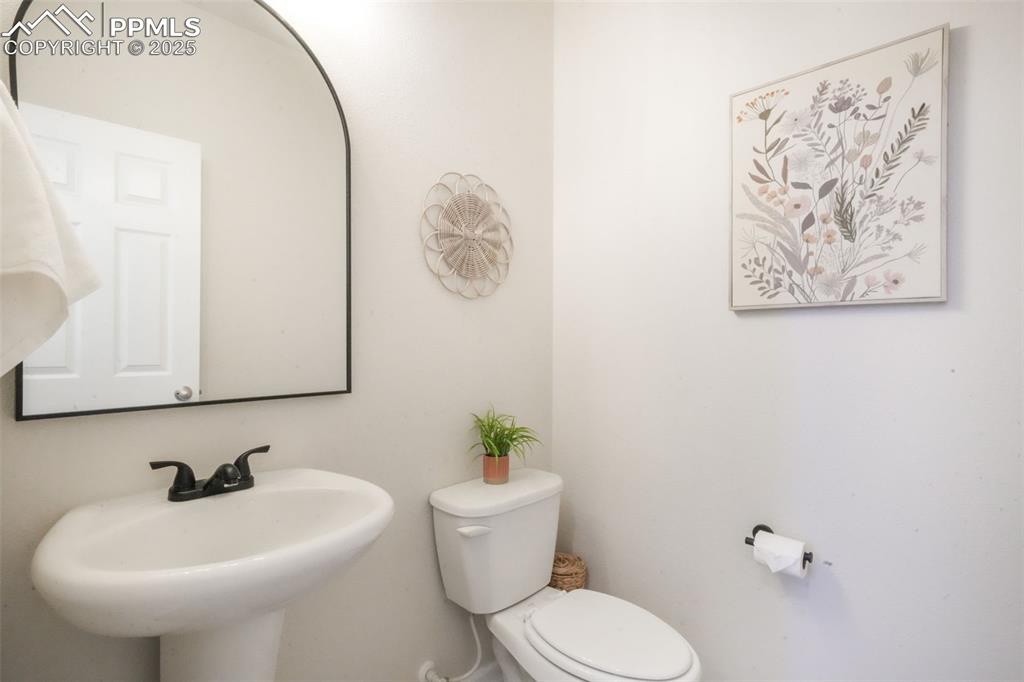 Image 18 of 50: Bathroom with toilet and a sink