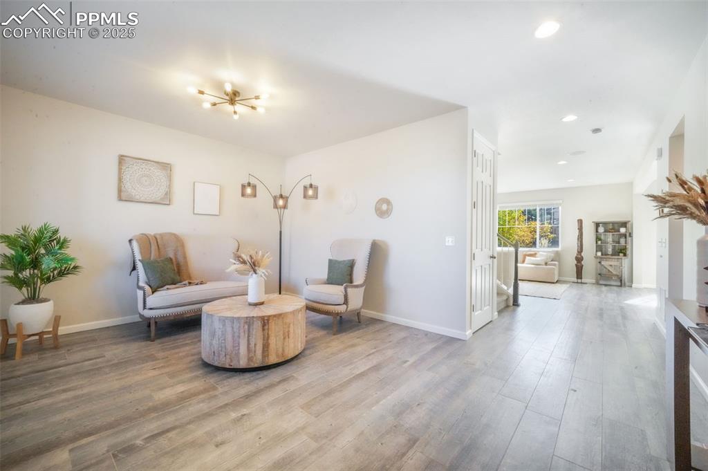 Image 3 of 50: Sitting room featuring wood finished floors and recessed lighting