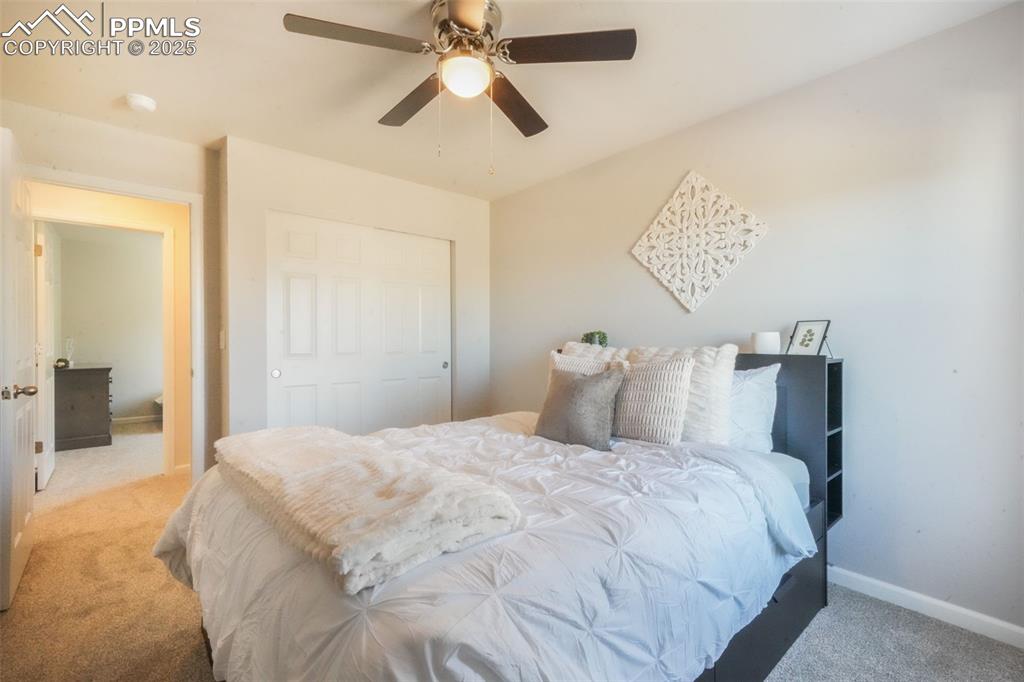 Image 36 of 50: Bedroom featuring carpet floors, a ceiling fan, and a closet