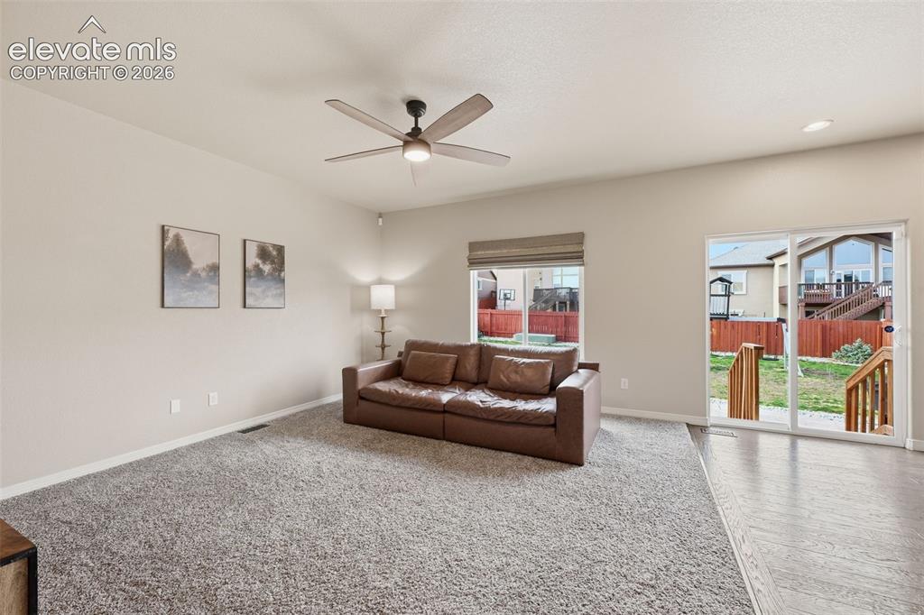 Image 11 of 37: Seamless flow from kitchen to dining areas.