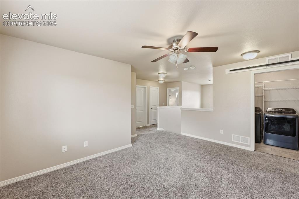 Image 19 of 37: Open, flowing living room & kitchen space
