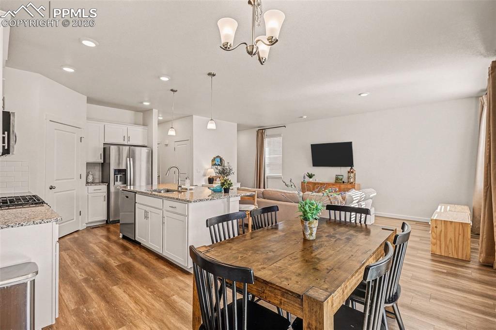Image 4 of 22: Convenient dining area with walkout to patio and back yard.