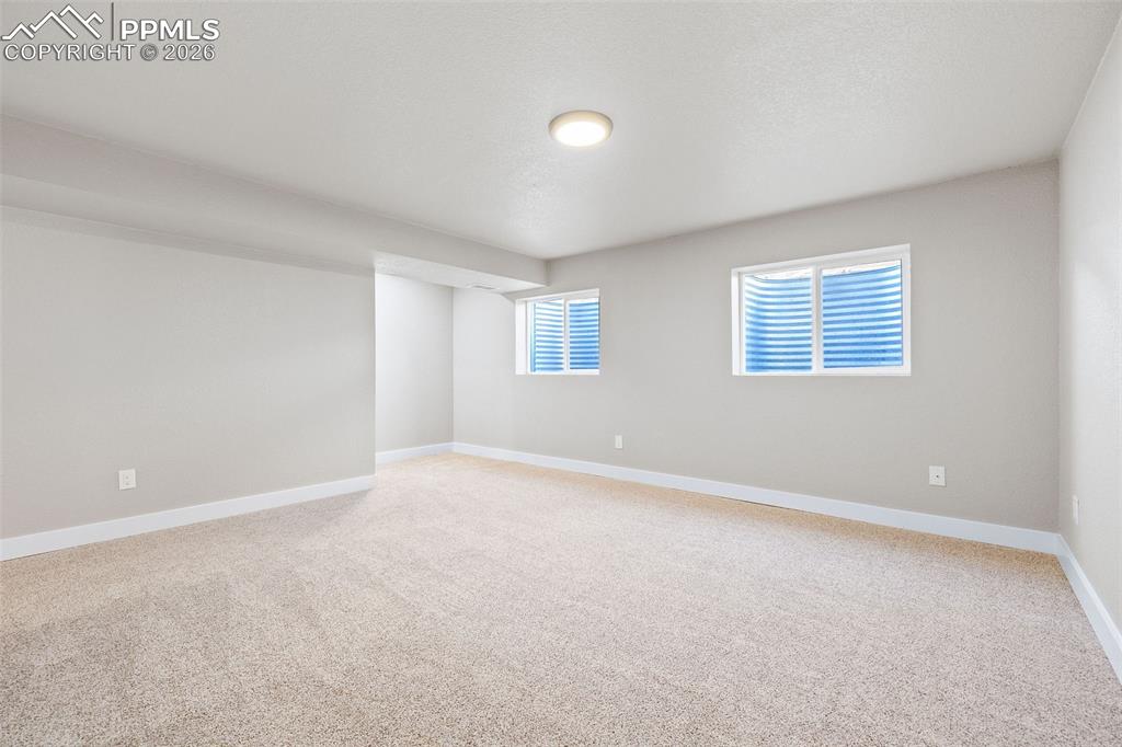 Image 23 of 26: Unfurnished room with light colored carpet and baseboards