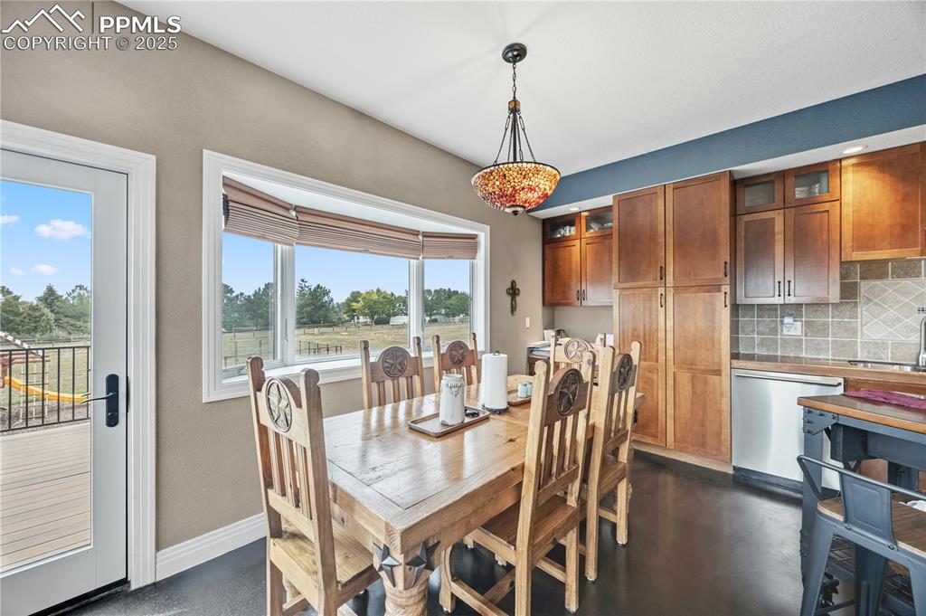 Image 10 of 40: Dining space featuring baseboards