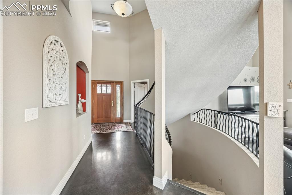 Image 3 of 40: Entrance foyer with plenty of natural light and a high ceiling
