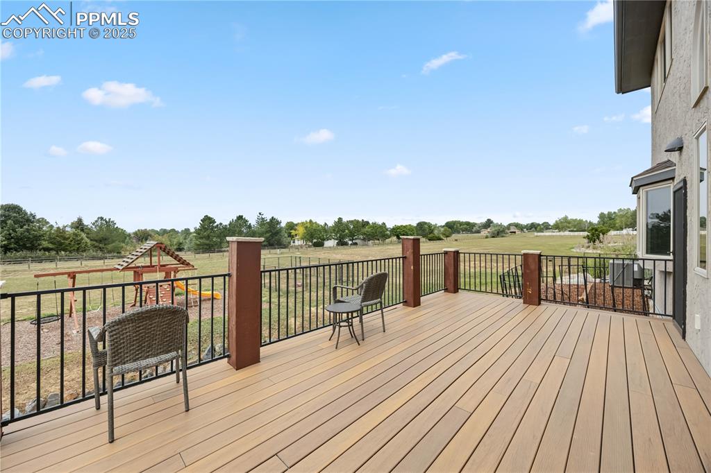 Image 37 of 40: Wooden terrace featuring a rural view