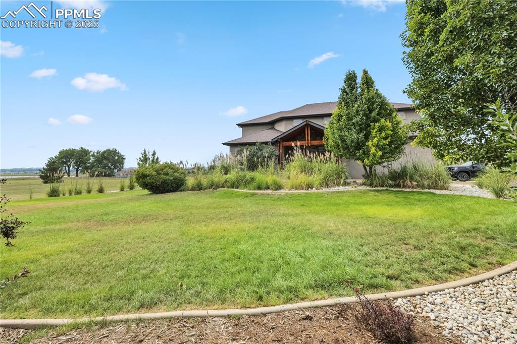 Image 38 of 40: View of grassy yard