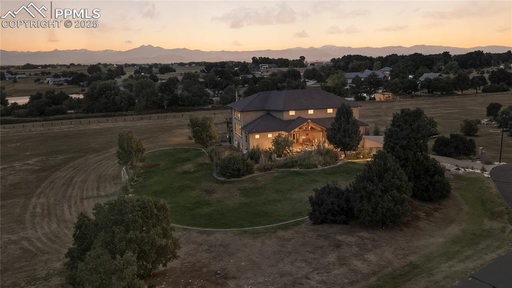 Image 39 of 40: Aerial view of property and surrounding area with rural landscape
