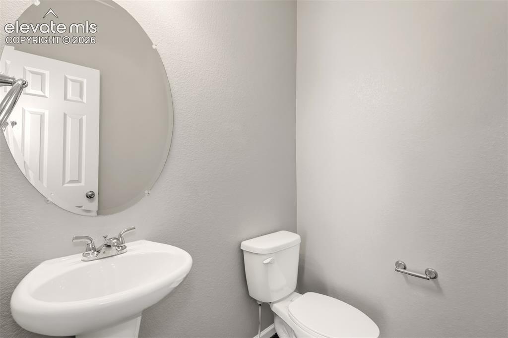 Image 16 of 41: Downstairs half bath.