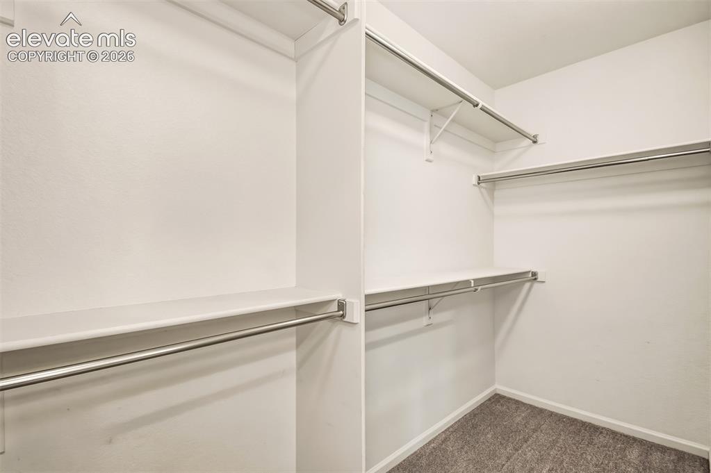 Image 22 of 41: Primary bedroom closet.