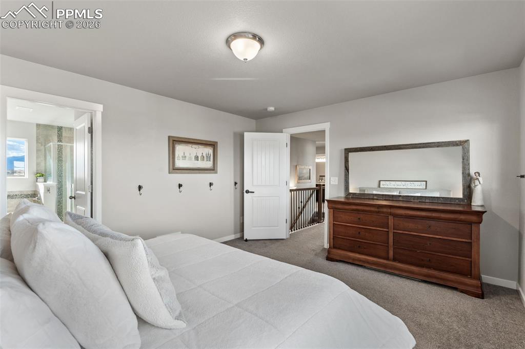 Image 16 of 42: Primary Bedroom on upper level with 5 piece en suite attached