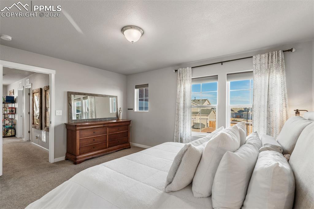 Image 18 of 42: Primary Bedroom on upper level with 5 piece en suite attached