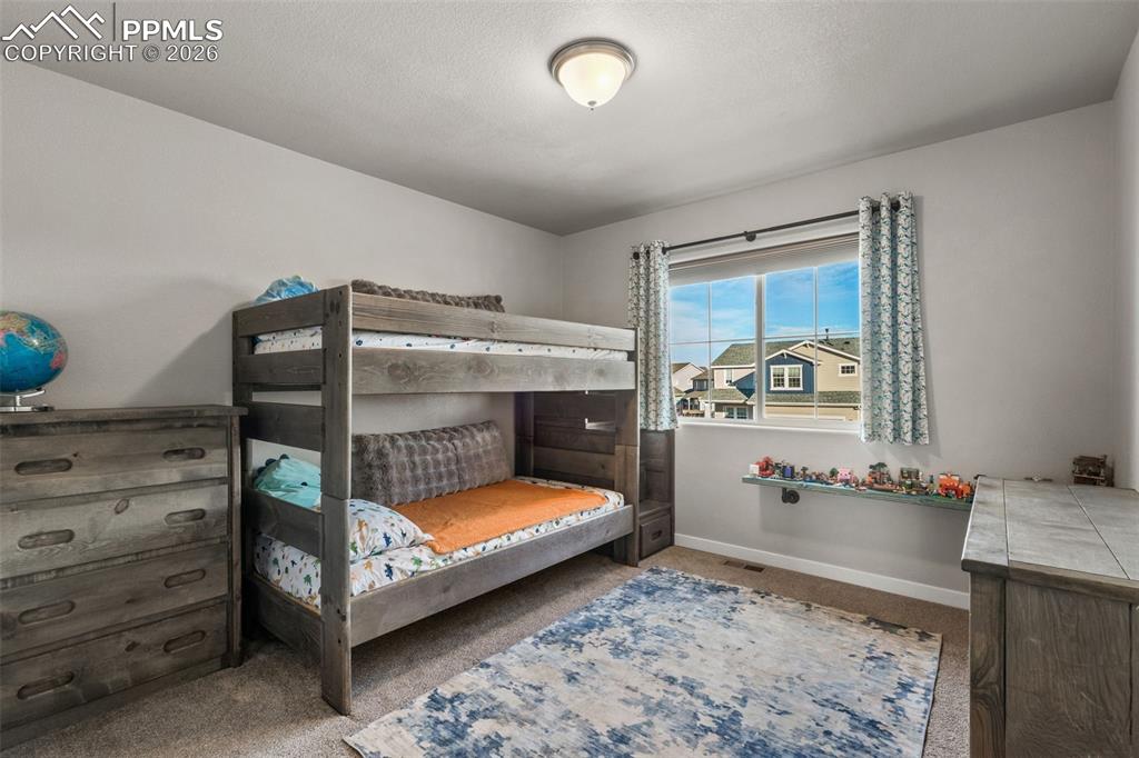 Image 25 of 42: Additional bedroom on upper level 