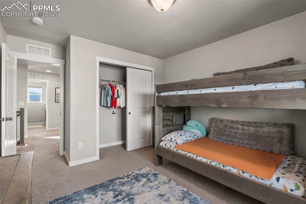 Image 26 of 42: Additional bedroom on upper level 