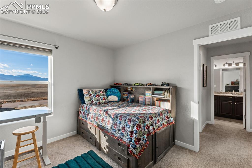 Image 28 of 42: Additional bedroom on upper level 