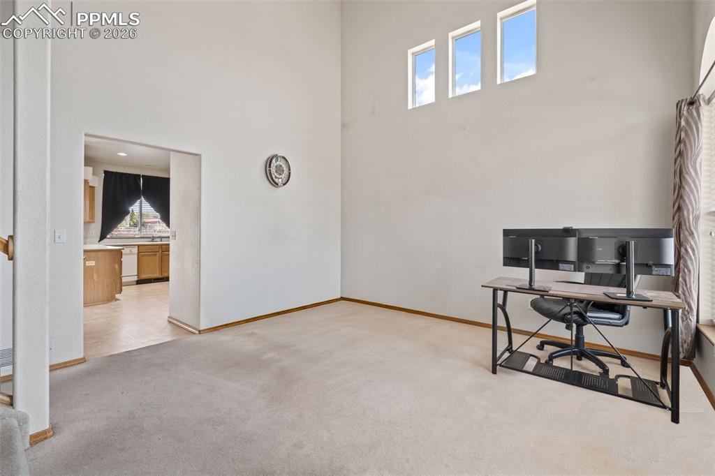 Image 6 of 40: High ceilings with three upper windows providing natural illumination