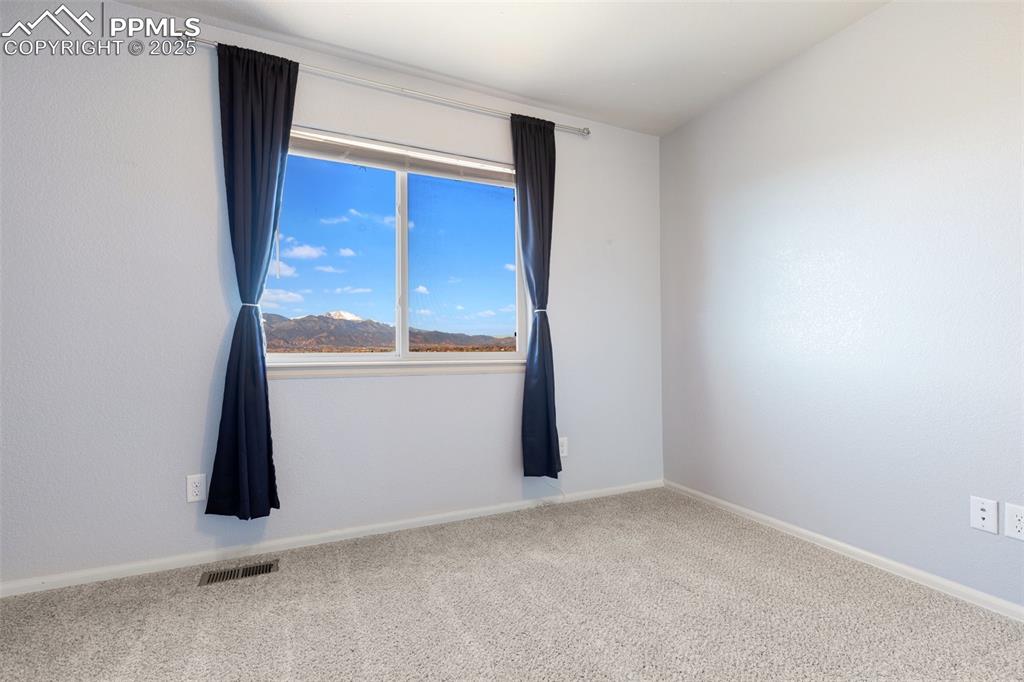 Image 28 of 42: Carpeted empty room featuring baseboards