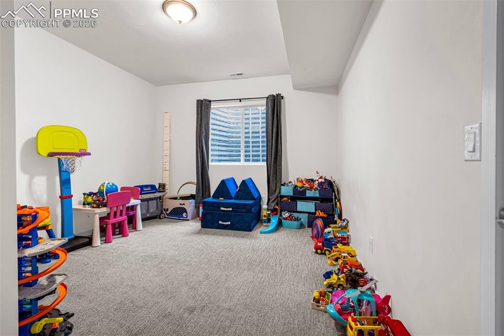 Image 27 of 31: Basement Bedroom