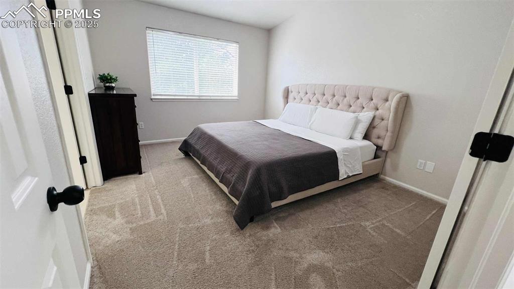 Image 11 of 35: Bedroom featuring carpet flooring and baseboards