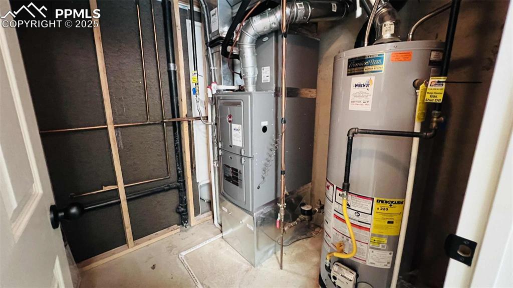 Image 27 of 35: Utilities featuring gas water heater and heating unit