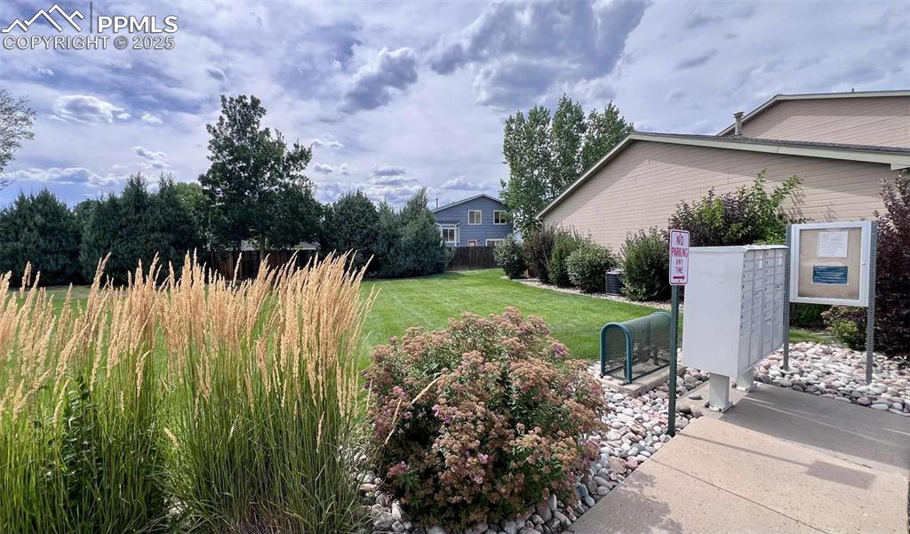 Image 28 of 35: View of yard with mail area