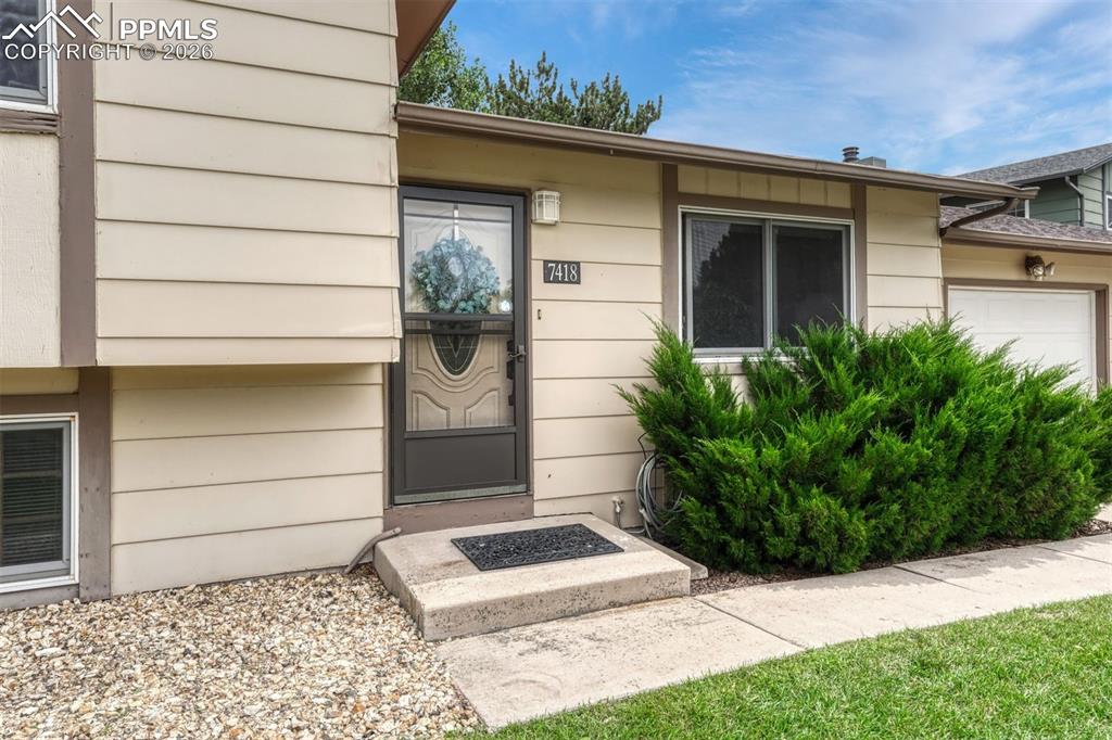 Image 14 of 33: Storm door provides security and more natural light