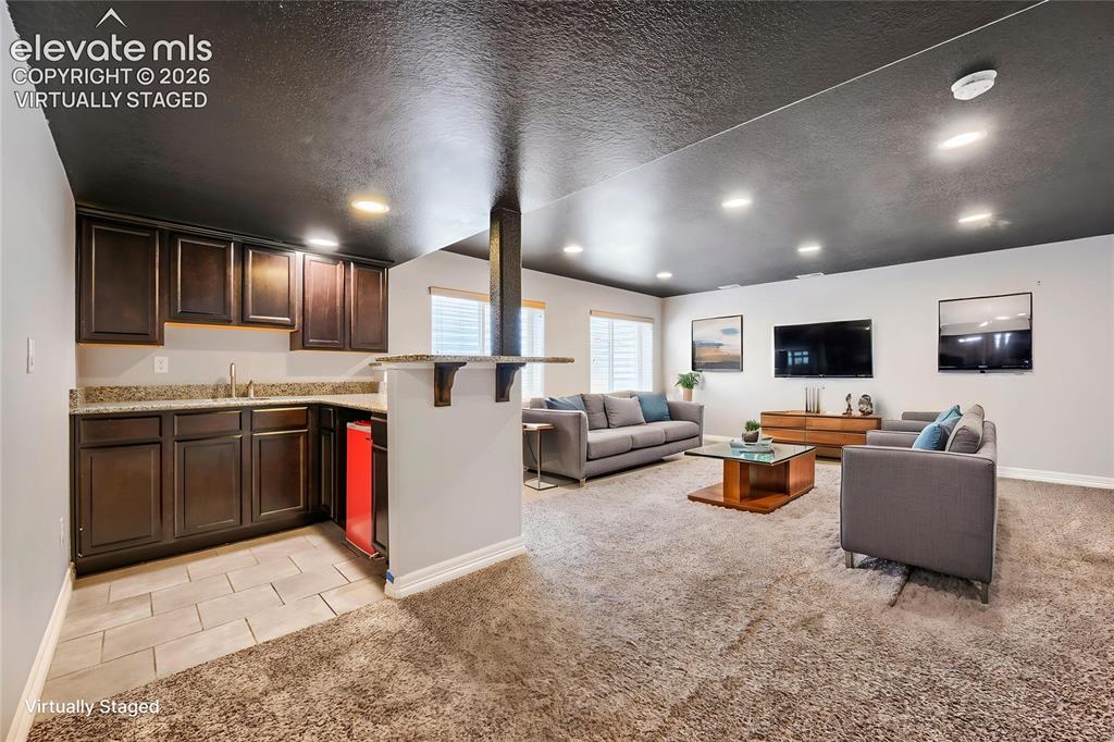 Image 26 of 40: Virtually Staged Basement Family Room