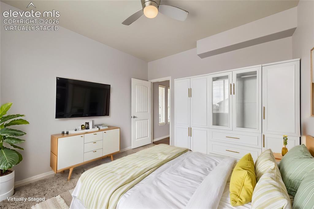 Image 4 of 40: Virtually Staged Main Level Bedroom