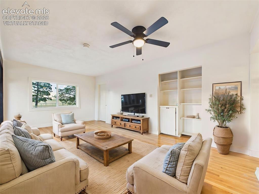 Image 15 of 50: (Virtually Staged) Living Area – Open gathering space features beautiful fl