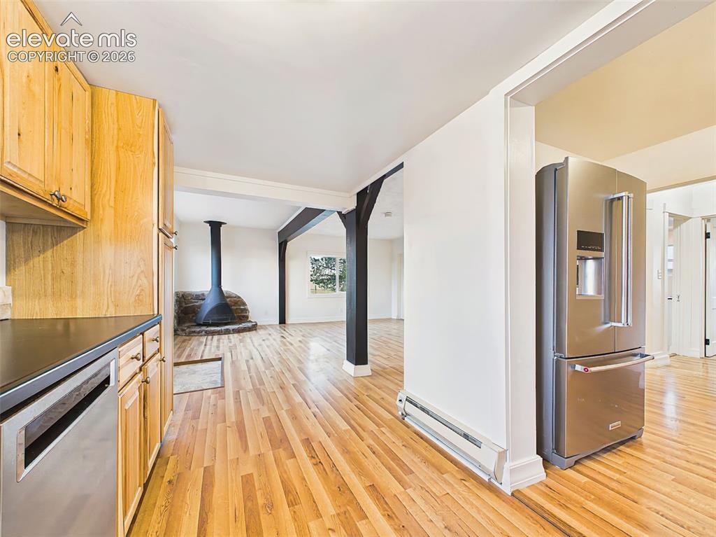 Image 21 of 50: Kitchen opens seamlessly to the great room, offering an efficient layout wi