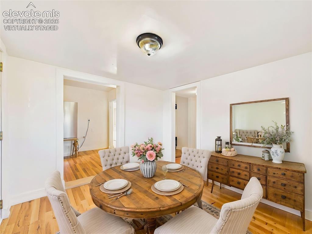 Image 22 of 50: (Virtually Staged) Dining Room – Bright dining space comfortably accommodat