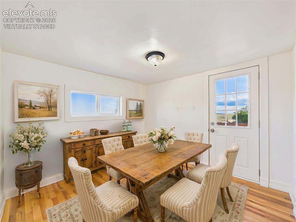 Image 24 of 50: (Virtually Staged) Dining Room – Charming dining space offers room for a fu