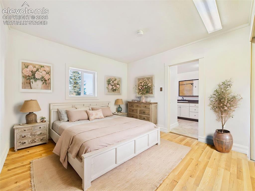 Image 27 of 50: (Virtually Staged) Primary Bedroom – Spacious primary bedroom features hard