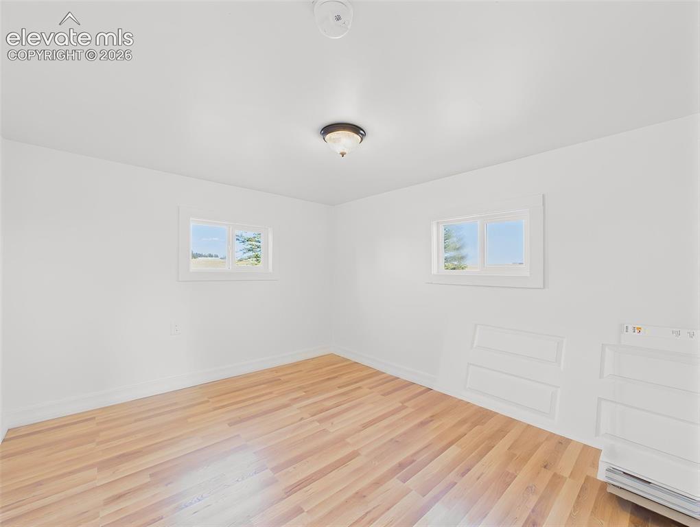 Image 31 of 50: Secondary Bedroom – Spacious secondary bedroom offers a large closet, new f