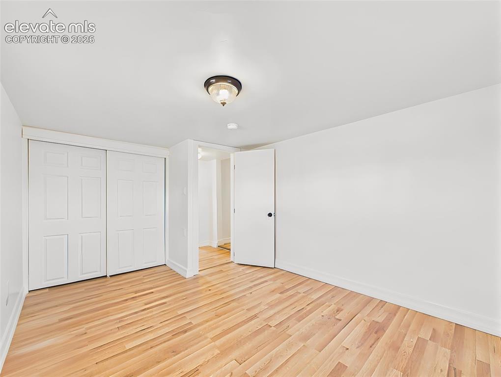 Image 32 of 50: Secondary Bedroom – Spacious secondary bedroom offers a large closet, new f