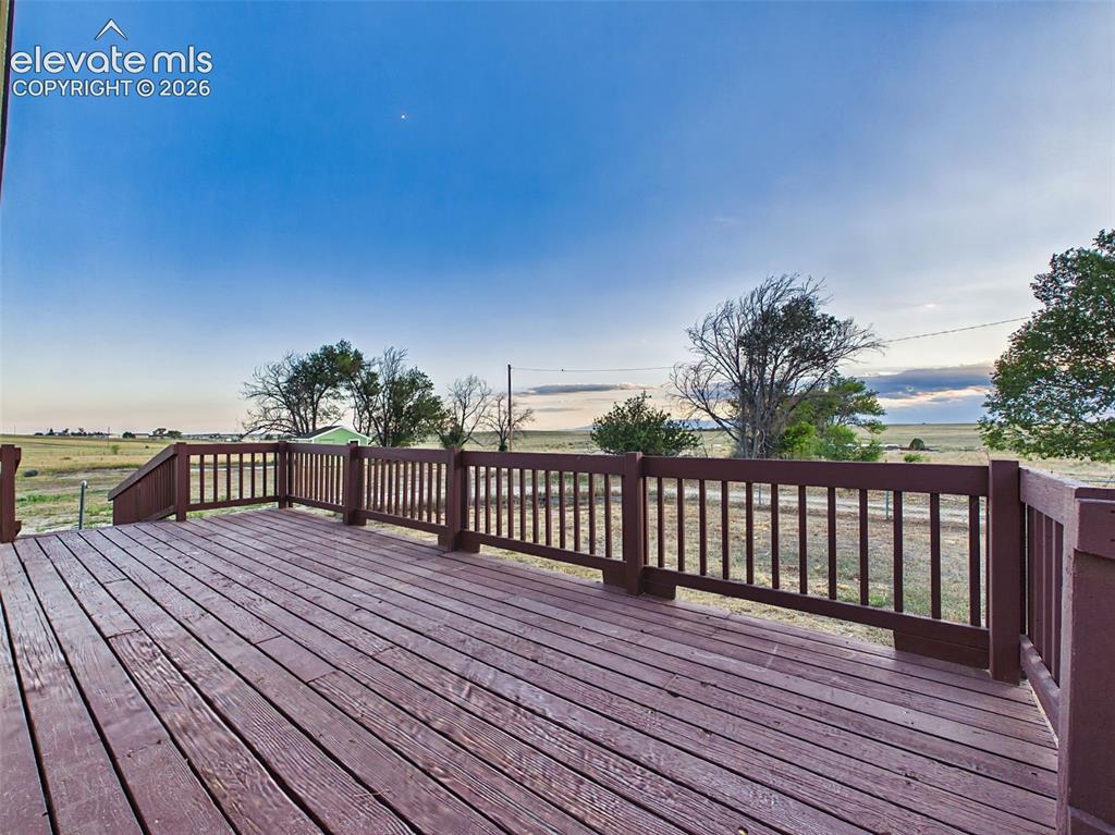 Image 41 of 50: Deck – Spacious deck offers an ideal setting for outdoor dining, relaxing,
