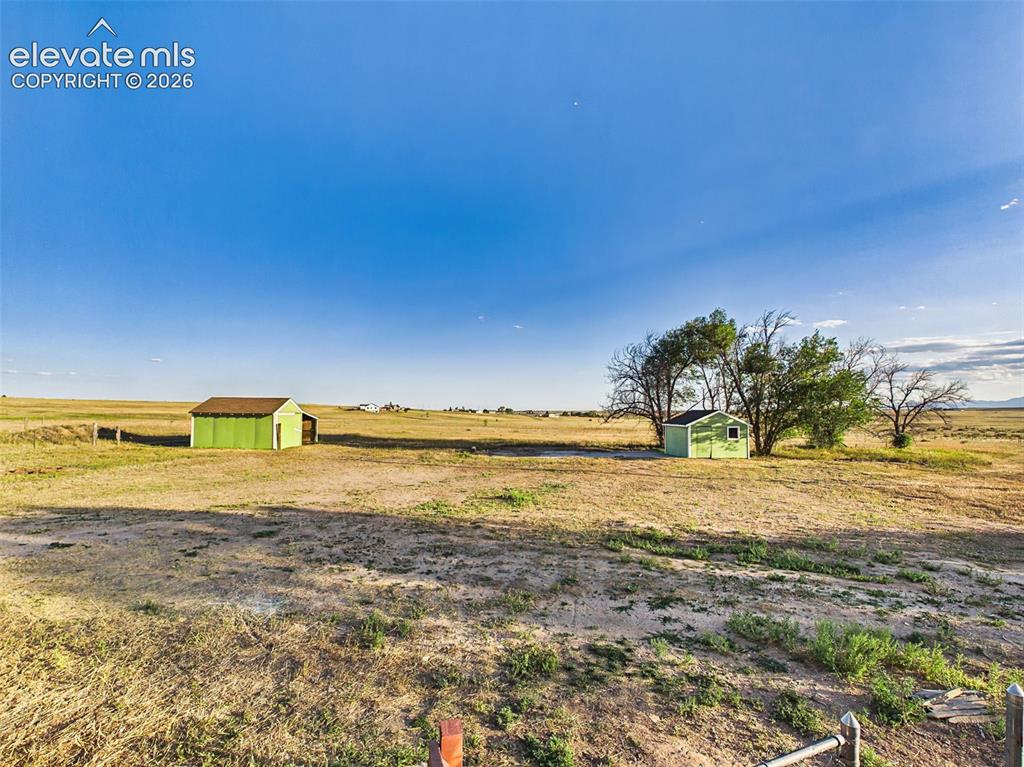 Image 42 of 50: Property Grounds – Expansive grounds feature multiple outbuildings and plen