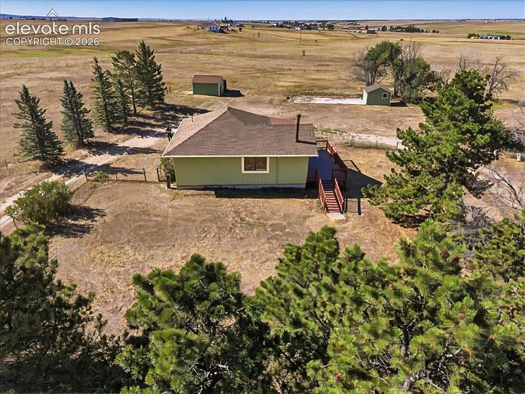 Image 48 of 50: Backyard Aerial – Rear aerial highlights the home