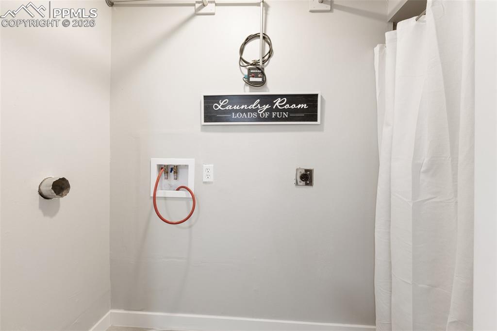 Image 41 of 47: Lower level laundry area