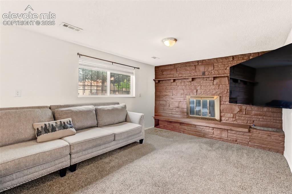 Image 12 of 18: Large Family Room with Fireplace