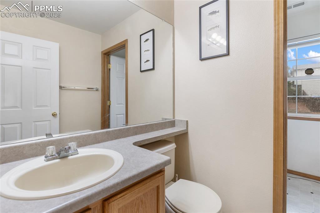 Image 17 of 28: Lower bathroom featuring vanity and toilet