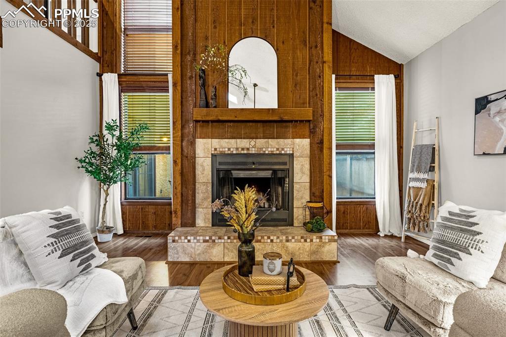 Image 2 of 19: Woodburning fireplace, vaulted ceilings, windows out to one of two private