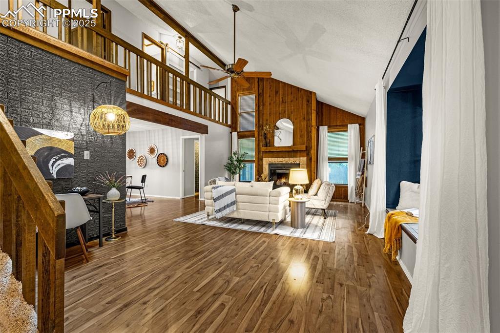 Image 3 of 19: This home offers ample living space with window seat, ceiling fan and centr